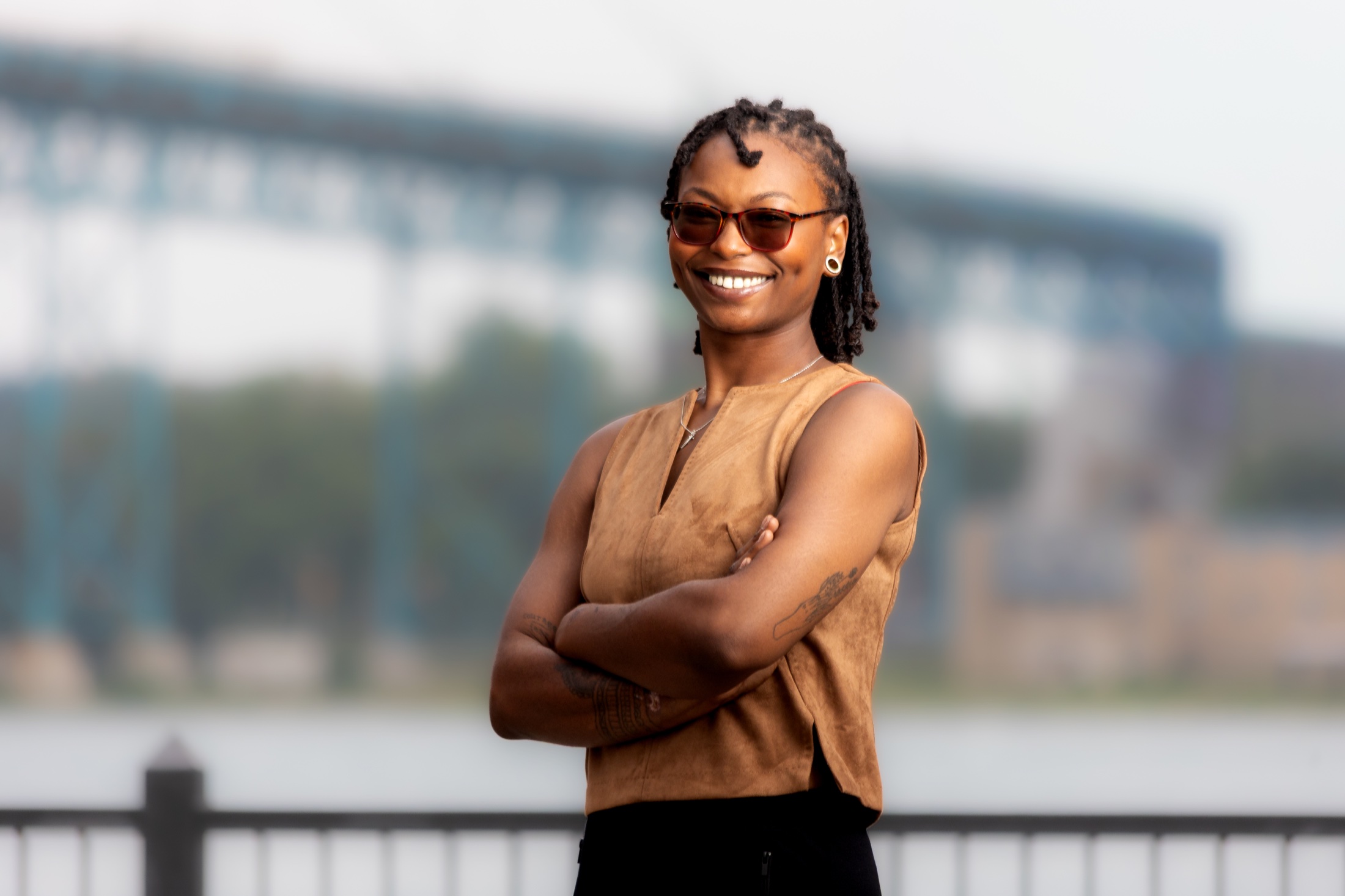 Detroit branding portrait of a business owner standing with arms folded